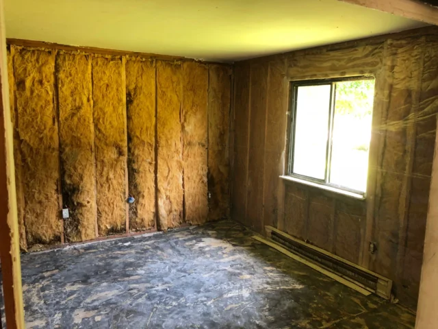 Moldmen NJ a room undergoing remediation where the insulation is exposed 640x480
